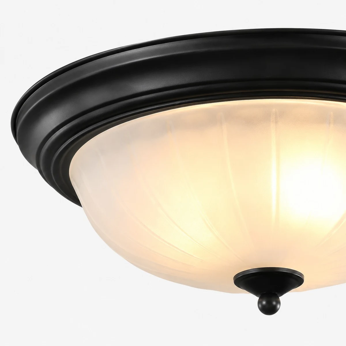 Close-up of frosted glass shade and warm light